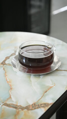 drip coffee in very nice cup on marble table