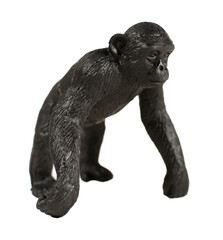 Plastic chimpanzee toy, isolated on white background.