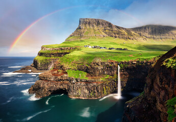 Faroe island landscape - waterfall with rainbow, Denmark - 755436959