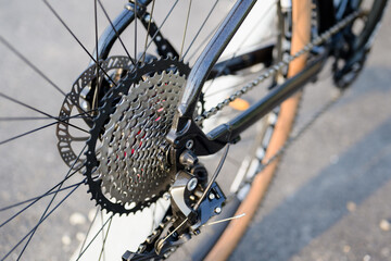 Closeup bicycle gear wheels, mechanic gears cassette and derailleur at the rear wheel of a mountain bike