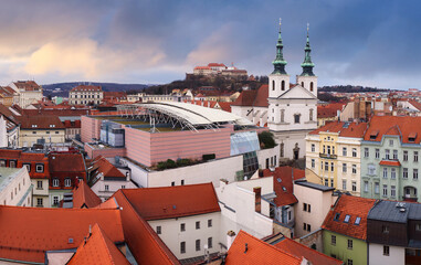 Panorama of Brno skyline with castle Spilberg, main square and cathedral Petrov at dramatic sunset. Czech Republic - 755437923