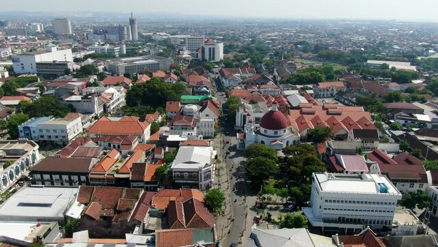 Colorful rooftops and endless horizon of Semarang city in Indonesia, aerial view