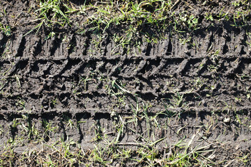 Mud tyre mark background. Tire track shape. Trail lines on black sand pattern. Road construction...
