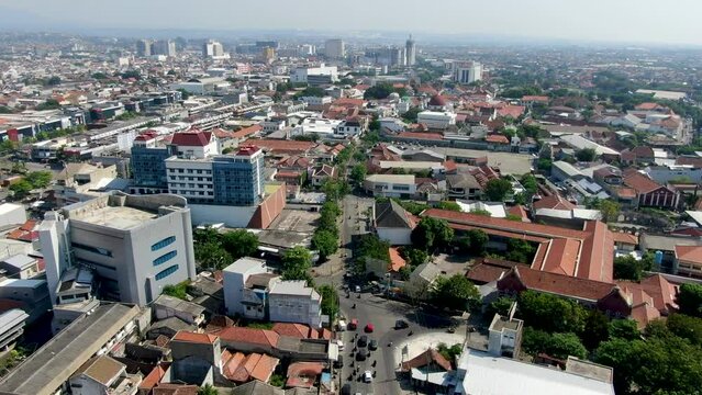 City buildings of Semarang in Indonesia, aerial drone flying view