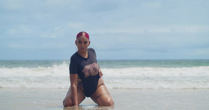 Beneath the swaying palm trees of a Caribbean oasis, a girl in a monokini embraces the island lifestyle.