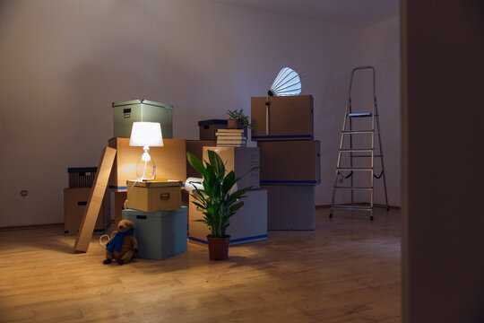 Cardboard boxes in an empty room in a new home