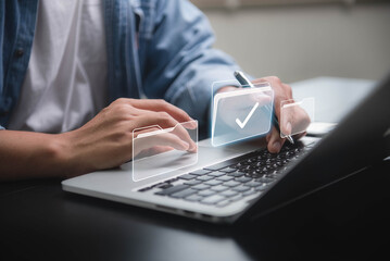 Document management system concept, A businessman checks over digital documents on a virtual screen. Process automation and document management systems enable effective document paperless operations.