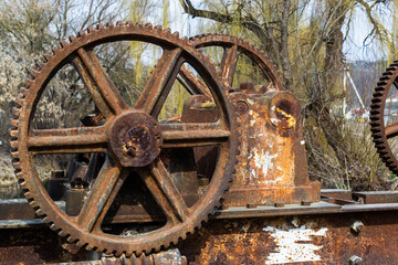 old mechanical metal gears mechanism on the abandoned dam