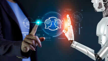 AI, Machine learning language, Robotic hand and human touch global virtual represents the exchange of artificial intelligence brains with humans. Exchange of human thoughts. AI technology essential. © okawa