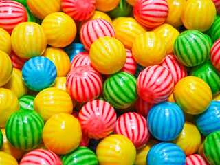 Fototapeta na wymiar Pile of colorful round candy background.