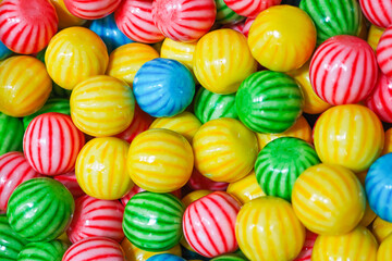 Fototapeta na wymiar Pile of colorful round candy background.