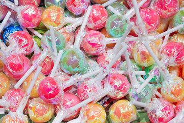 Mixed colorful sweets lollypop background.