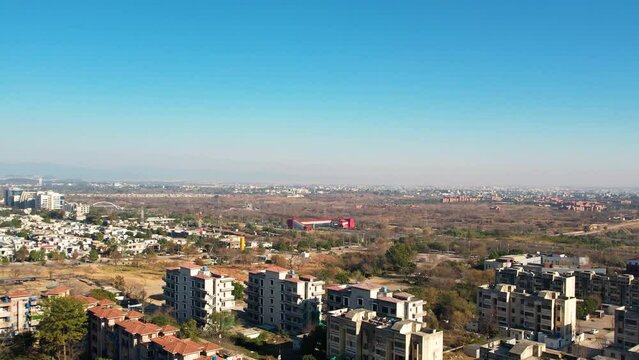 Aerial drone shot of Islmabad, sringar highway with metor station on a sunny day