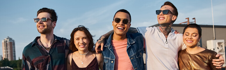 cheerful diverse people in urban outfits with sunglasses having fun and smiling at camera, banner