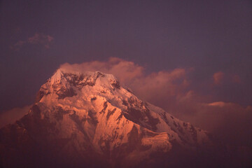 Annapurna South snow mountain in Nepal with evening glow