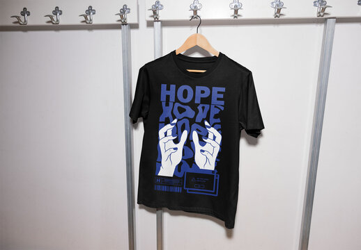Mockup of customizable t-shirt hanging on peg