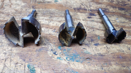 three large forstner wood hole bits