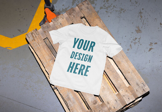 Mockup of customizable t-shirt on wooden pallet