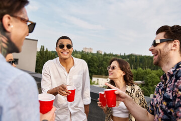 attractive jolly diverse friends with stylish sunglasses spending time together at rooftop party