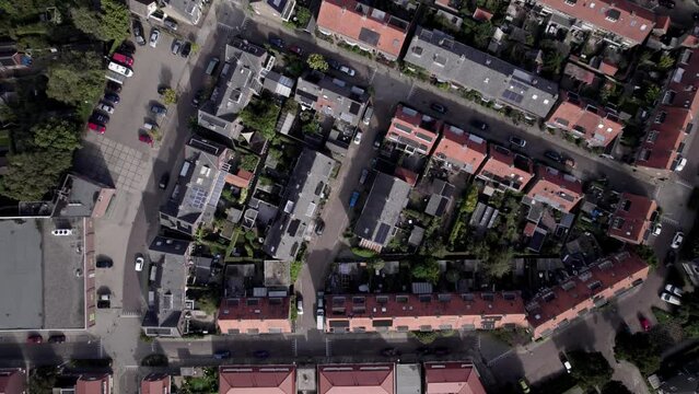 Slow aerial top down showing residential neighbourhood Noordveen in suburbs of Zutphen with distinct shape. City planning, street plan, infrastructure and urban development concept seen from above.