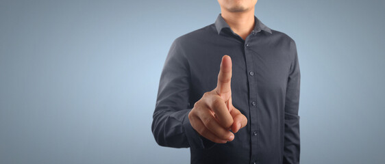 Businessman pressing button virtual screen