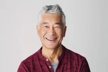 Fotobehang Portrait of old healthy, cheerful handsome Asian senior man smiling and looking at camera with white background. Happy aging society, retirement, teeth, health and senior healthcare concept © myboys.me