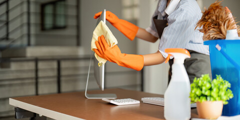 Woman clean in office room at office. Housekeeper or maid cleaner feel happy wipe mop and clean the...