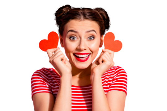 Close-up portrait of her she nice cute charming attractive lovely cheerful cheery optimistic glad girl wearing striped t-shirt holding in hands small little hearts isolated over pink background