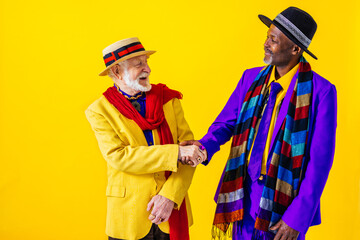 Cool senior men with fashionable outfit portrait on colorful background