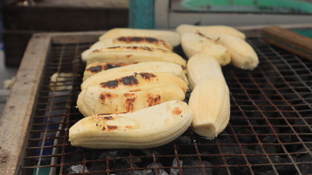 Pisang gapit or pisang epe or grilled bananas, the indonesian traditional cakes. served with coconut and palm sugar or brown sauce. mostly found in Sulawesi or makassar city