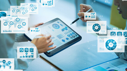 Worker using tablet PC and statistical data. Digital transformation. Paperless work.