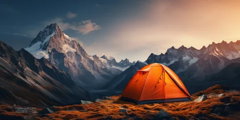Fotobehang Glowing orange tent camping in the mountains in front of majestic mountain range © Sanych