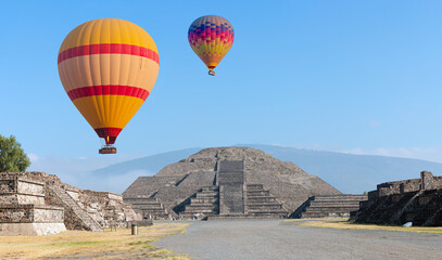Fototapeta na wymiar Hot air balloon flying over Teotihuacan pyramids complex located in Mexican Highlands and Mexico Valley close to Mexico City. Mexico
