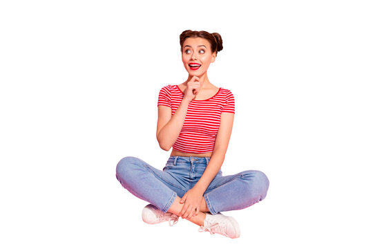 Full length body size photo beautiful she her lady buns pomade lips hold hand arm chin look empty space wondered wear casual jeans denim striped red white t-shirt sit floor isolated pink background