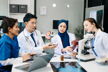 Medical, meeting and doctors with laptop for research, planning and hospital schedule management. Health, professional and people team for brainstorming in hospital