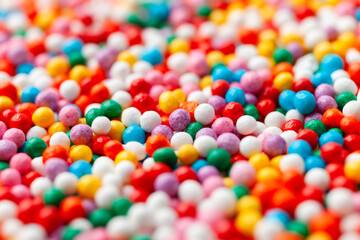 Colorful confectionery sprinkles close-up. Decoration for cake and bakery. 