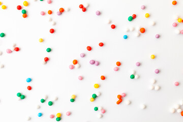 Colorful confectionery sprinkles on white background. Decoration for cake and bakery.