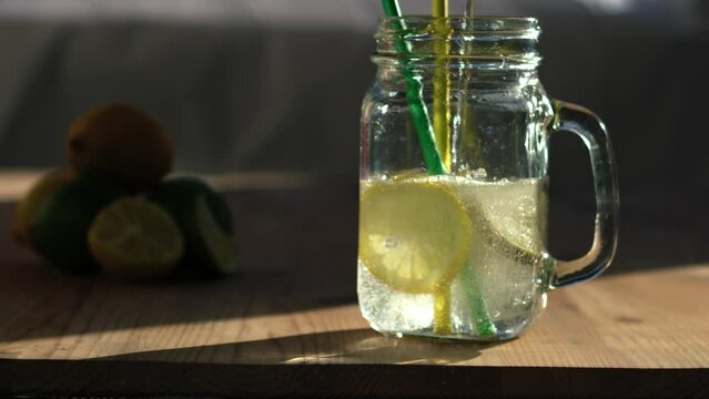 Lemon and lime flavor fizzy water served in glass drinking jar