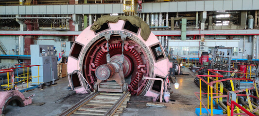 20.07.2022, Moldova, Chisinau: Power generator of industrial steam turbine in reparation process at...