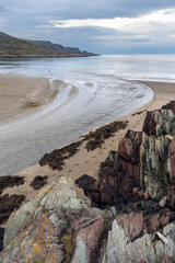 Rock formations and a small river delta by the Barents Sea on a cloudy summer day, Vesterelva, Vardø, Finnmark