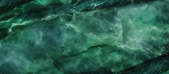 This close up showcases the intricate patterns and shades of green found in a high-resolution marble texture. The image captures the veins, swirls, and unique characteristics of the green marble in