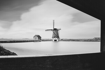 Dutch heritage Windmill 'Het Noord' on island Texel at the unesco Wadden Sea landscape in the Netherlands - 755549769