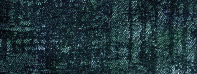 Texture of velvet dark green background from upholstery textile material. Abstract velour emerald...