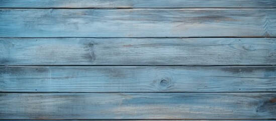 A detailed view of an old wooden wall with peeling blue paint, showcasing a vintage and weathered aesthetic. The texture of the wood and cracking paint adds character to the background, ideal for