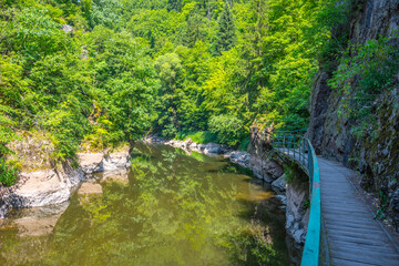 Wooden bridge pathway above Jizera River. Rieger Trail between Semily and Spalov. Czechia