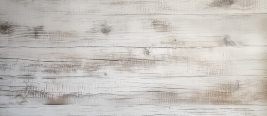 A white wooden wall with a gray stain visible throughout the texture of the wood. The contrast between the white and gray creates a visually interesting pattern and adds character to the wall.