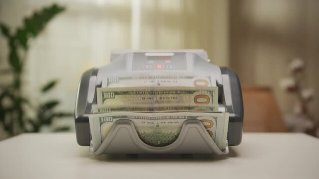 Hundred Dollar Bills in Counting Machine