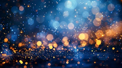 Tuinposter Festive background. Falling small round pieces of gold foil, glowing circles of different sizes on blue blurred bokeh background. Holiday, celebration, Christmas, New Year, Valentine’s Day. Copy space © Marina_Nov