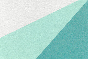 Texture of old craft white, mint and turquoise color paper background, macro. Vintage abstract cyan...