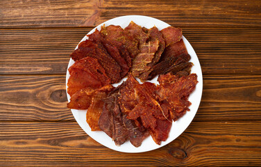 Mix of dried meat Jerky . From chicken , beef and pork.